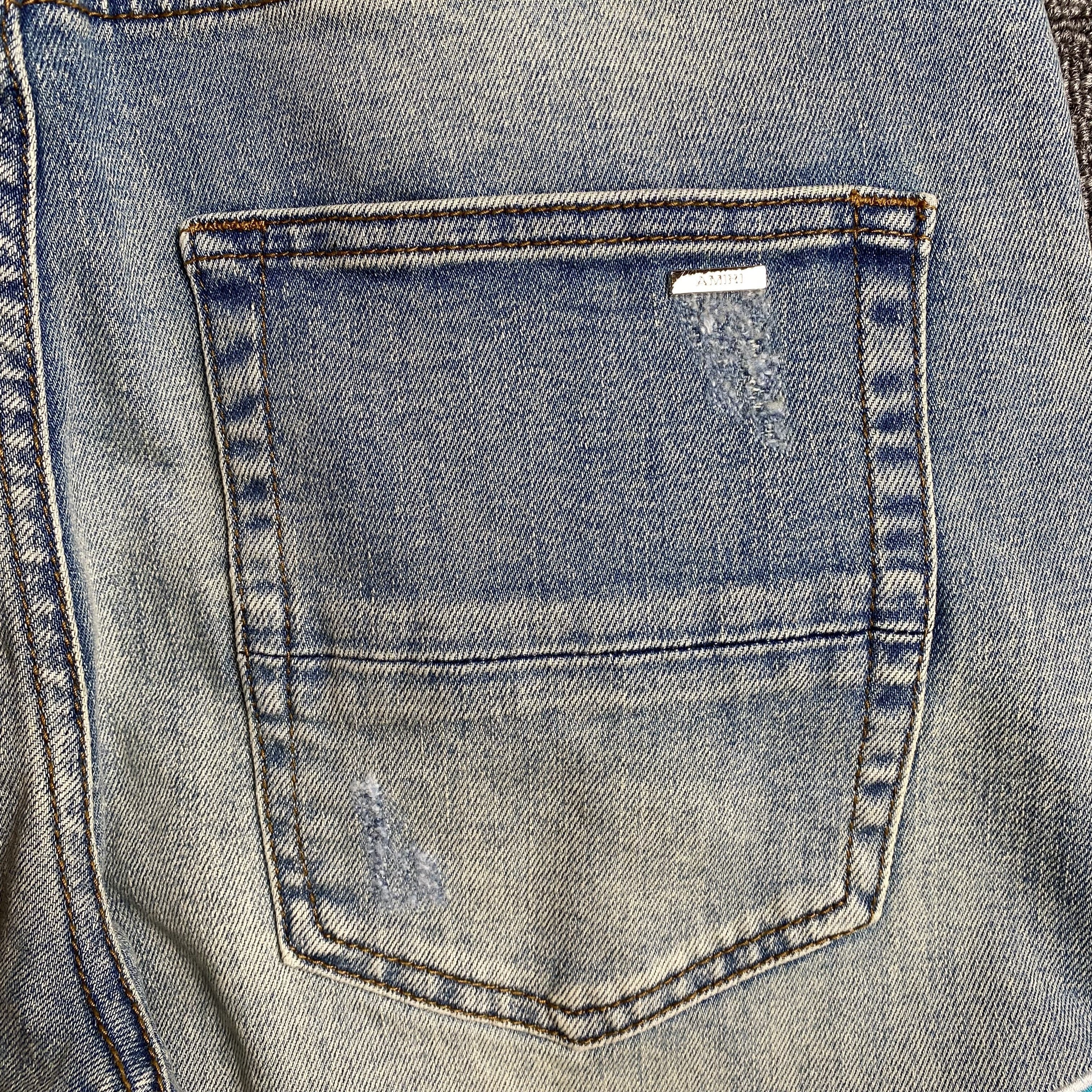 AMIRI VARSITY LOGO JEANS