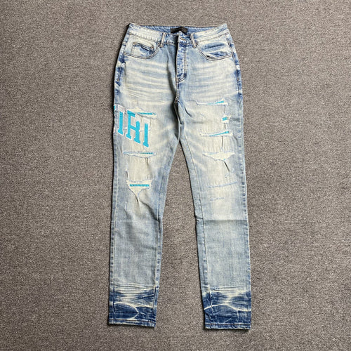 AMIRI VARSITY LOGO JEANS