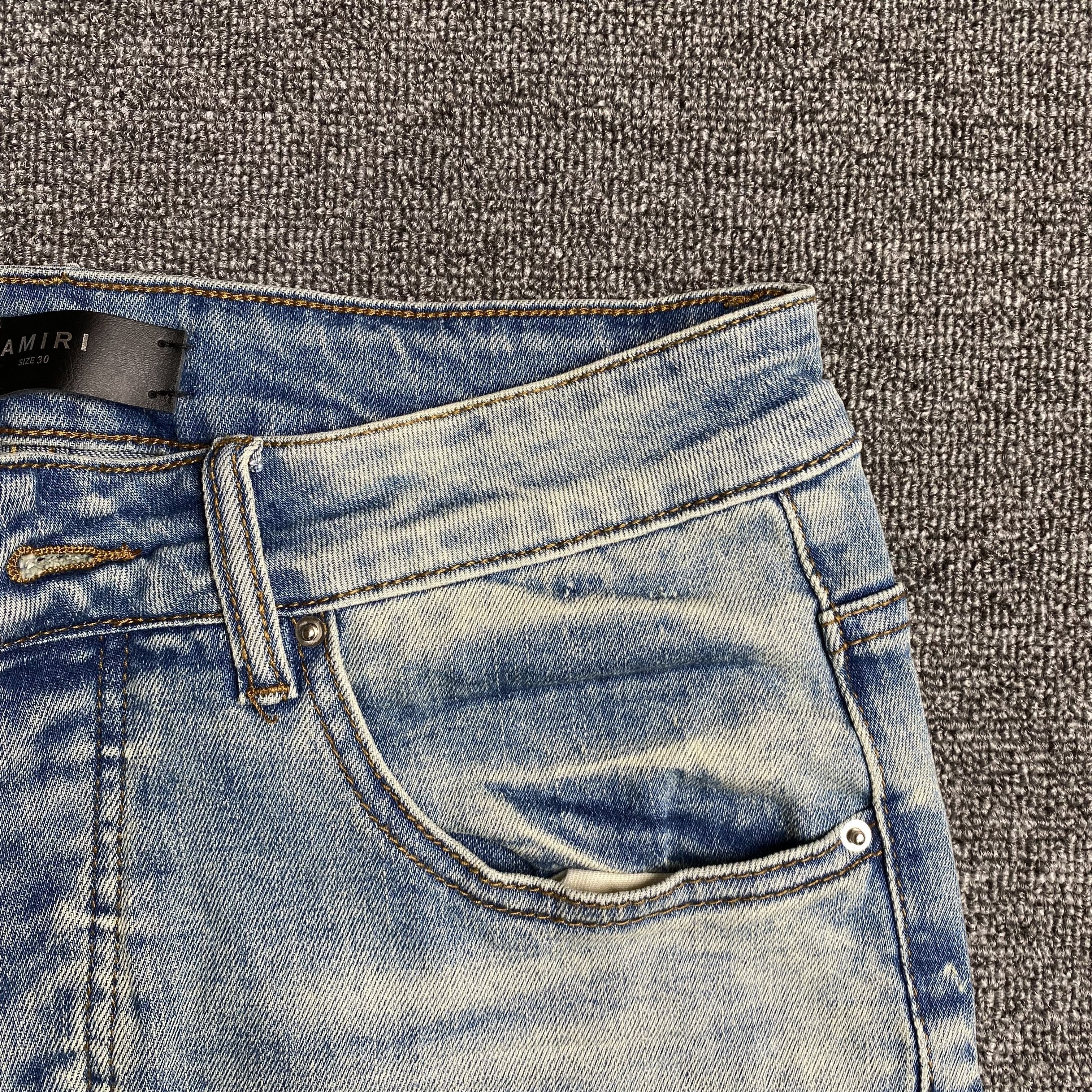 AMIRI VARSITY LOGO JEANS